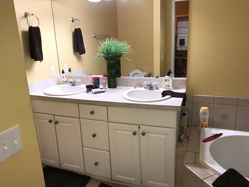 bathroom vanity and tub before a remodel by CorHome