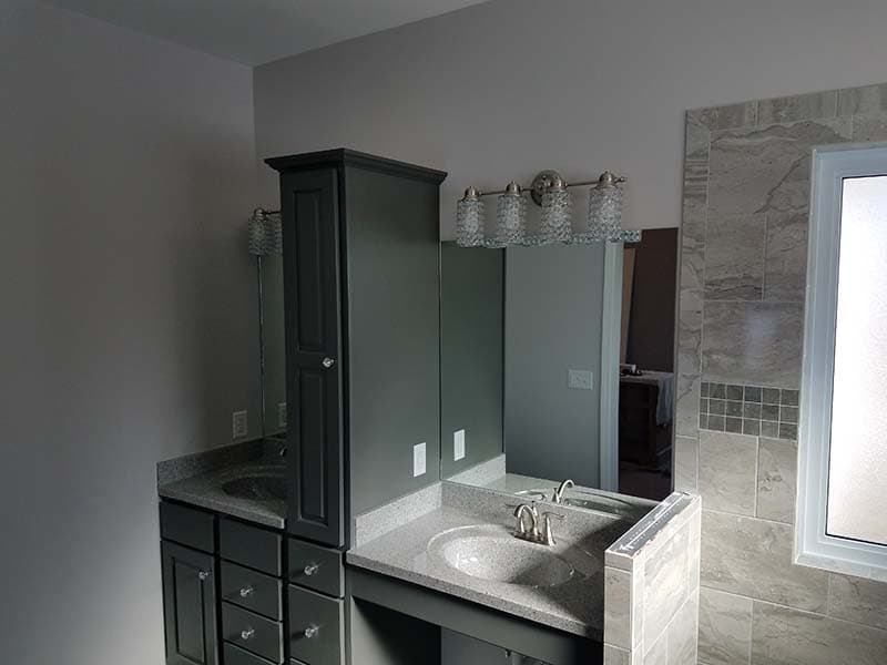 vanity and walk-in shower after a remodel by CorHome