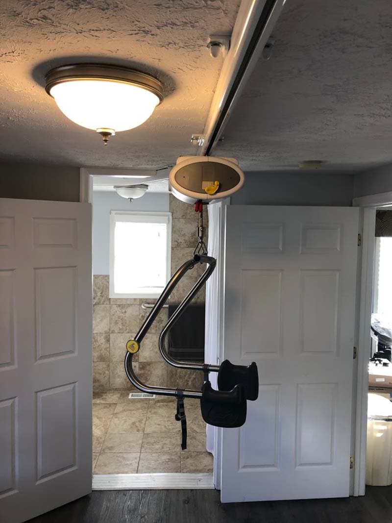 doorway to remodeled bathroom with an overhead lift