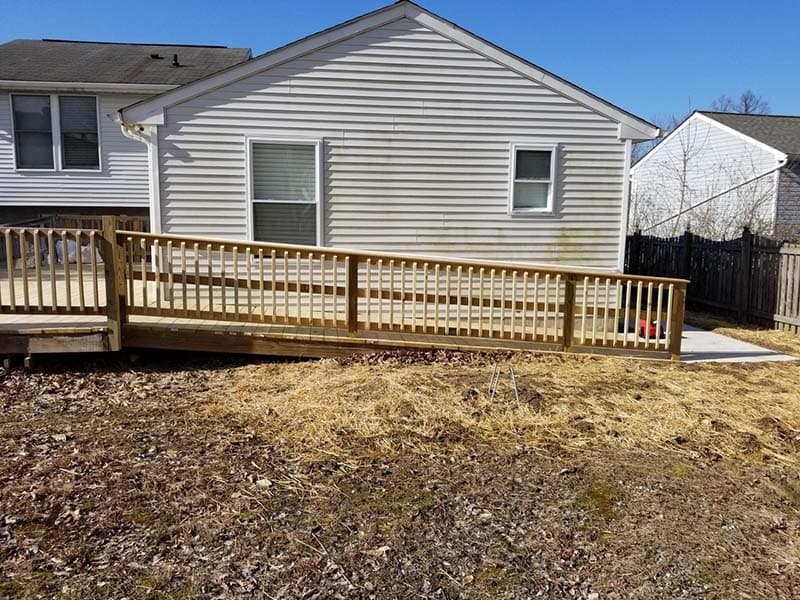 accessible ramp leading to porch with a newly constructed railing